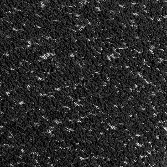 Swatch of the upholstery fabric on a contemporary black and metallic boucle loveseat