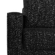 Front facing close up of the armrest and upholstery of a contemporary black and metallic boucle sofa on a white background