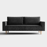 Front facing contemporary black and metallic boucle sofa on a white background