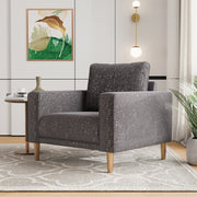 Right facing contemporary charcoal gray and metallic boucle accent armchair in a room with accessories