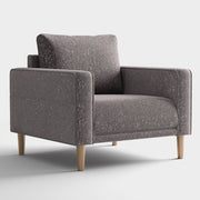 Right facing contemporary charcoal gray and metallic boucle accent armchair on a white background