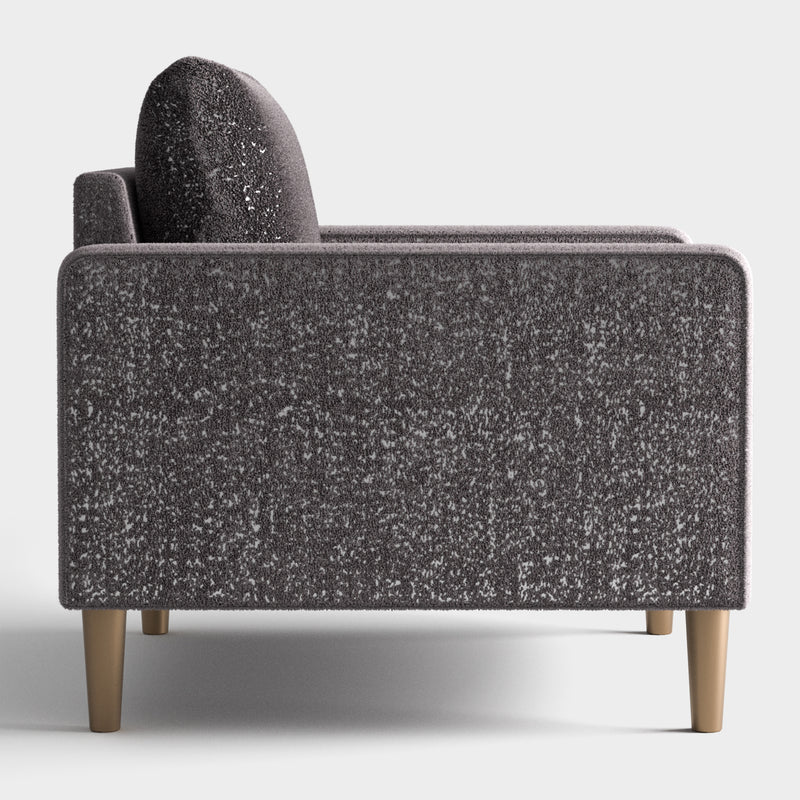 Front facing side view of a contemporary charcoal gray and metallic boucle accent armchair on a white background