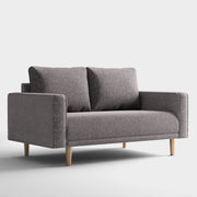 Right facing contemporary charcoal gray and metallic boucle loveseat on a white background
