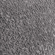 Swatch of the upholstery fabric on a contemporary charcoal gray and metallic boucle loveseat