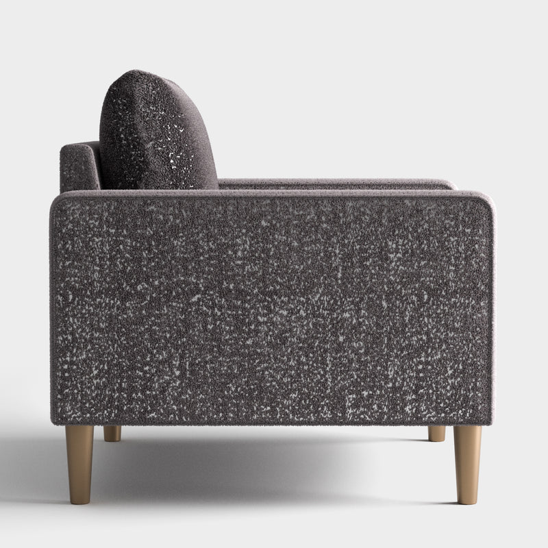Front facing side view of a contemporary charcoal gray and metallic boucle sofa on a white background