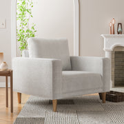 Right facing contemporary off-white metallic boucle accent armchair in a room with accessories