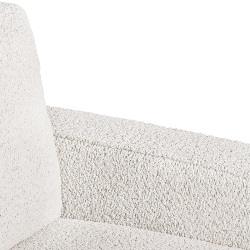 Right facing close up of the inner armrest of a contemporary off-white metallic boucle accent armchair on a white background