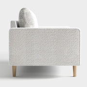 Front facing side view of a contemporary off-white metallic boucle accent armchair on a white background
