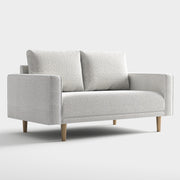 Right facing contemporary off-white metallic boucle loveseat on a white background