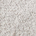 Swatch of the upholstery fabric on a contemporary off-white metallic boucle loveseat