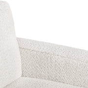 Right facing close up of the inner armrest of a contemporary off-white metallic boucle loveseat on a white background