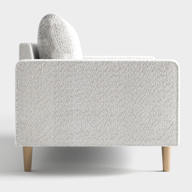 Front facing side view of a contemporary off-white metallic boucle loveseat on a white background