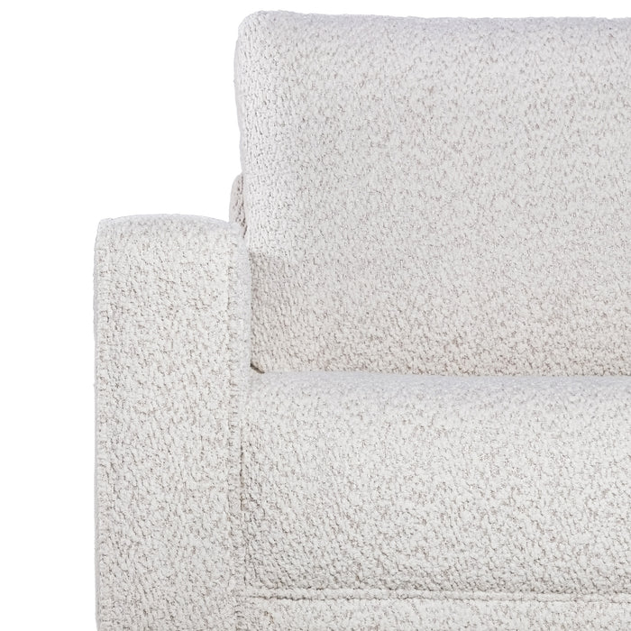 Front facing close up of the armrest and upholstery of a contemporary off-white metallic boucle sofa on a white background
