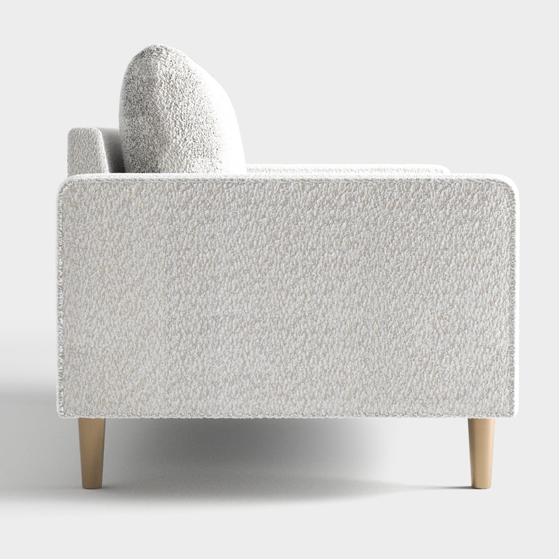 Front facing side view of a contemporary off-white metallic boucle sofa on a white background