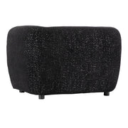 Right facing side view of a contemporary black metallic boucle shelter armchair on a white background