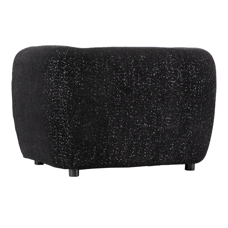Right facing side view of a contemporary black metallic boucle shelter armchair on a white background