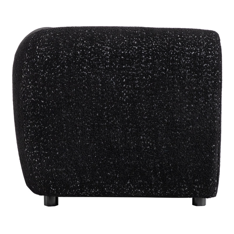 Front facing side view of a contemporary black metallic boucle shelter armchair on a white background