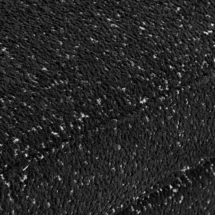 Swatch of the upholstery fabric on a contemporary black metallic boucle shelter loveseat