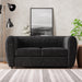 Front facing contemporary black metallic boucle shelter loveseat in a room with accessories