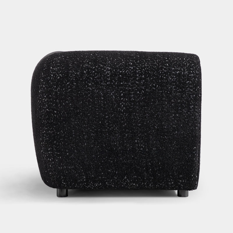 Front facing side view of a contemporary black metallic boucle shelter loveseat on a white background