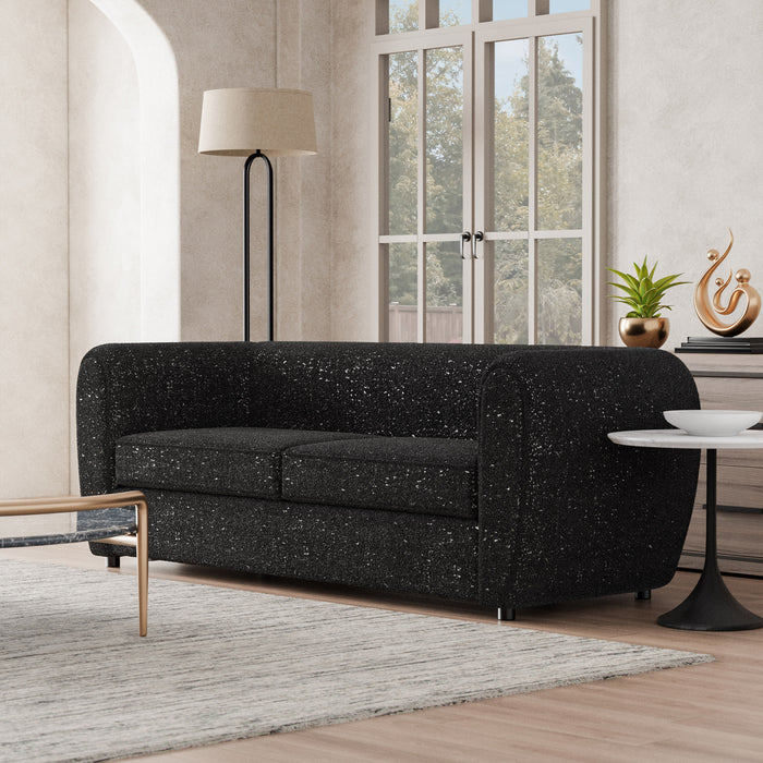 Left facing contemporary black metallic boucle shelter sofa in a room with accessories