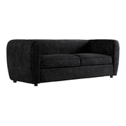 Right facing contemporary black metallic boucle shelter sofa on a white background