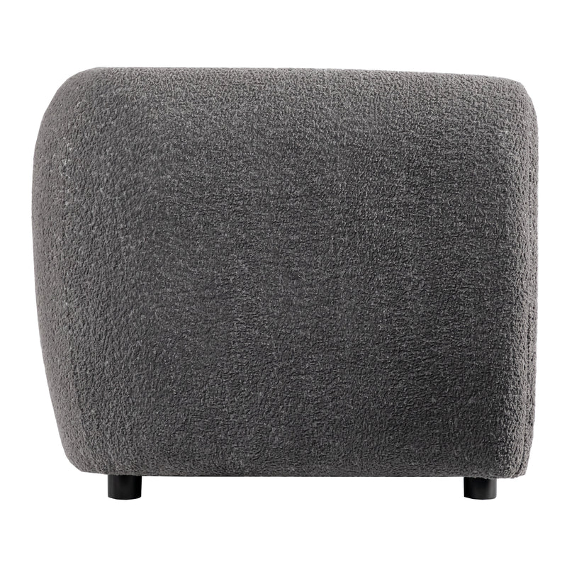Front facing side view of a contemporary charcoal gray metallic boucle shelter armchair on a white background