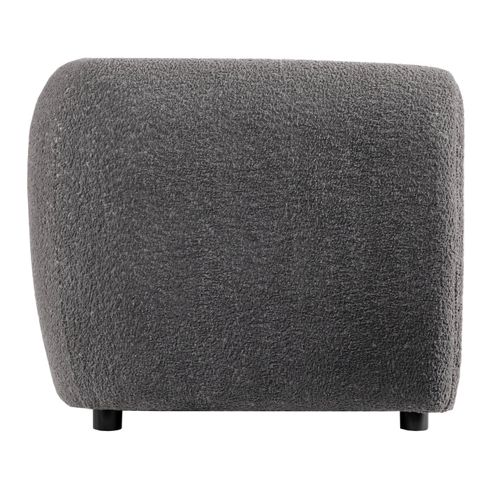 Front facing side view of a contemporary charcoal gray metallic boucle shelter armchair on a white background