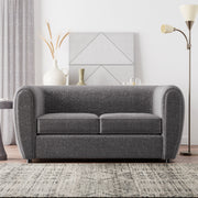 Front facing contemporary charcoal gray metallic boucle shelter loveseat in a room with accessories