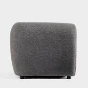 Front facing side view of a contemporary charcoal gray metallic boucle shelter loveseat on a white background