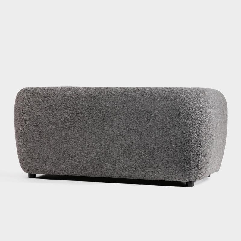 Right facing back view of a contemporary charcoal gray metallic boucle shelter loveseat on a white background