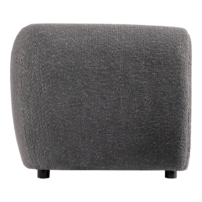 Front facing side view of a contemporary charcoal gray metallic boucle shelter sofa on a white background