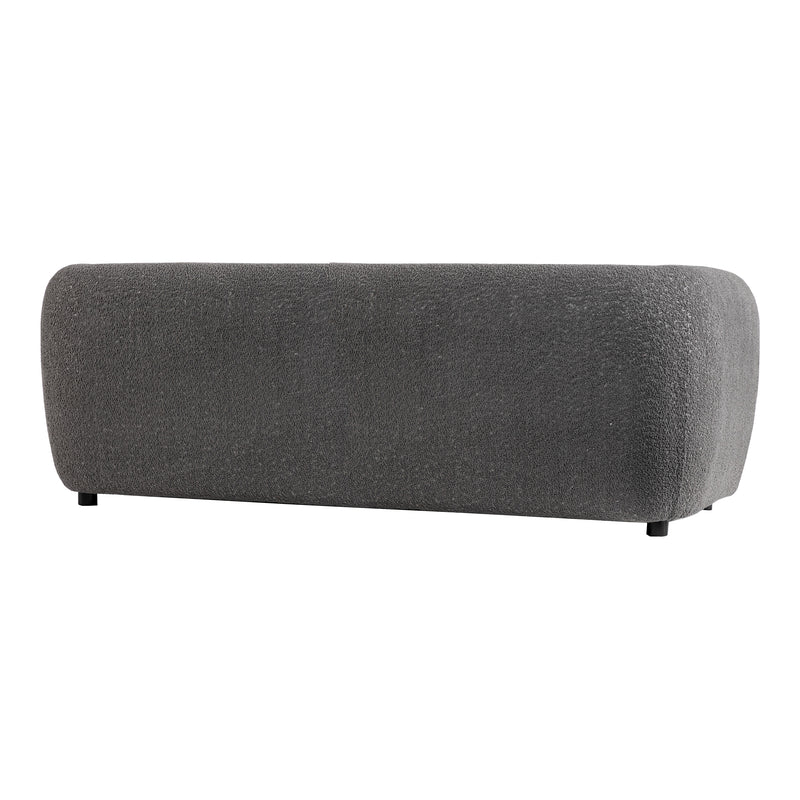 Right facing back view of a contemporary charcoal gray metallic boucle shelter sofa on a white background