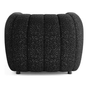 Front facing back view of a contemporary black and metallic boucle tufted shelter armchair on a white background