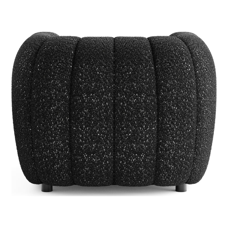 Front facing back view of a contemporary black and metallic boucle tufted shelter armchair on a white background