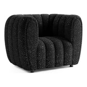 Right facing contemporary black and metallic boucle tufted shelter armchair on a white background
