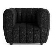 Front facing contemporary black and metallic boucle tufted shelter armchair on a white background
