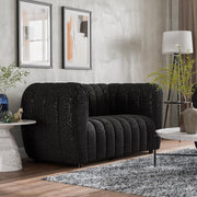 Right facing contemporary black and metallic boucle tufted shelter loveseat in a living room with accessories