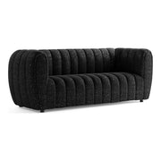 Right facing contemporary black and metallic boucle tufted shelter sofa on a white background