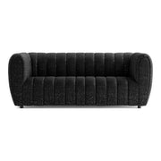 Front facing contemporary black and metallic boucle tufted shelter sofa on a white background