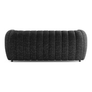 Front facing back view of a contemporary black and metallic boucle tufted shelter sofa on a white background