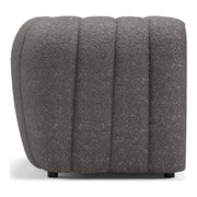 Front facing side view of a contemporary charcoal gray and metallic boucle tufted shelter armchair on a white background