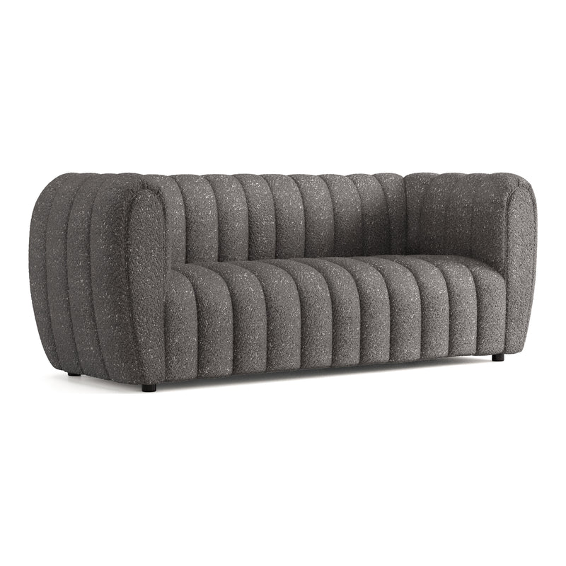 Right facing contemporary charcoal gray and metallic boucle tufted shelter sofa on a white background