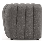 Front facing side view of a contemporary charcoal gray and metallic boucle tufted shelter sofa on a white background