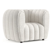 Right facing contemporary off-white metallic boucle tufted shelter armchair on a white background