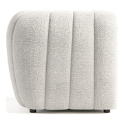 Front facing side view of a contemporary off-white metallic boucle tufted shelter armchair on a white background