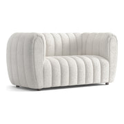 Right facing contemporary off-white metallic boucle tufted shelter loveseat on a white background