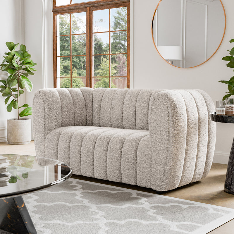 Left facing contemporary off-white metallic boucle tufted shelter loveseat in a room with accessories