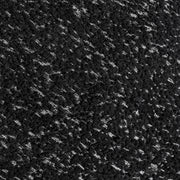 Swatch of the upholstery fabric on a contemporary black and metallic boucle curved kidney armchair