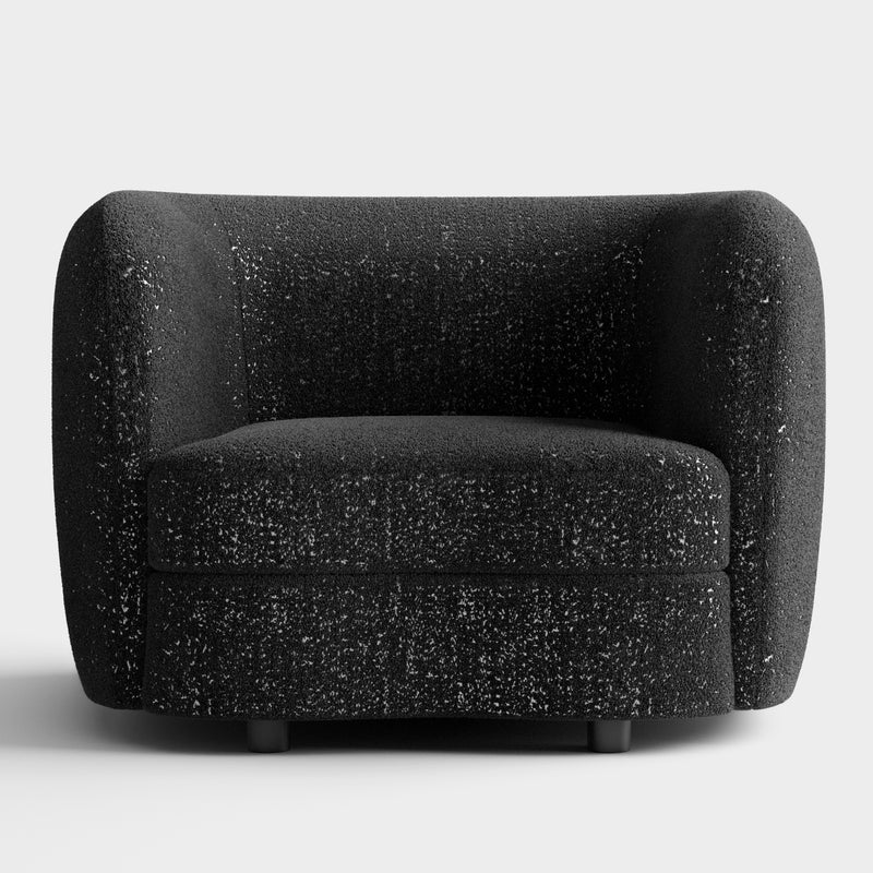 Front facing contemporary black and metallic boucle curved kidney armchair on a white background